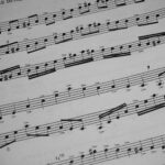 Detailed view of sheet music featuring musical notations and symbols.
