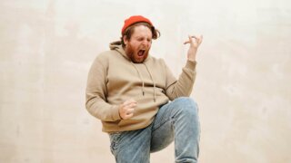 a man doing an air guitar