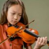 a girl playing a violin