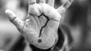 person with question mark on his palm